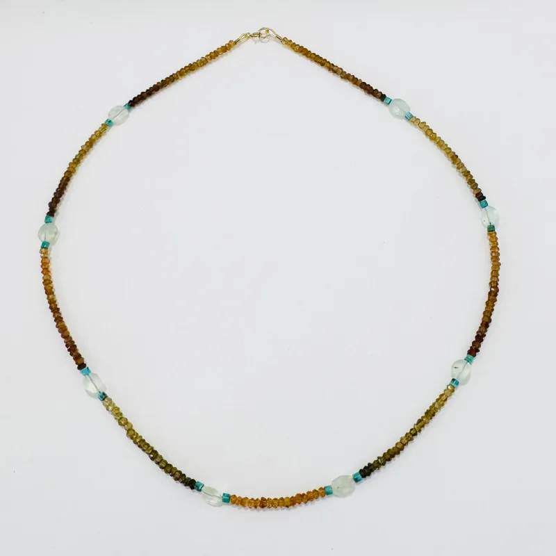 Hessonite garnet, turquoise, and prehnite delicate sold by Theodosia