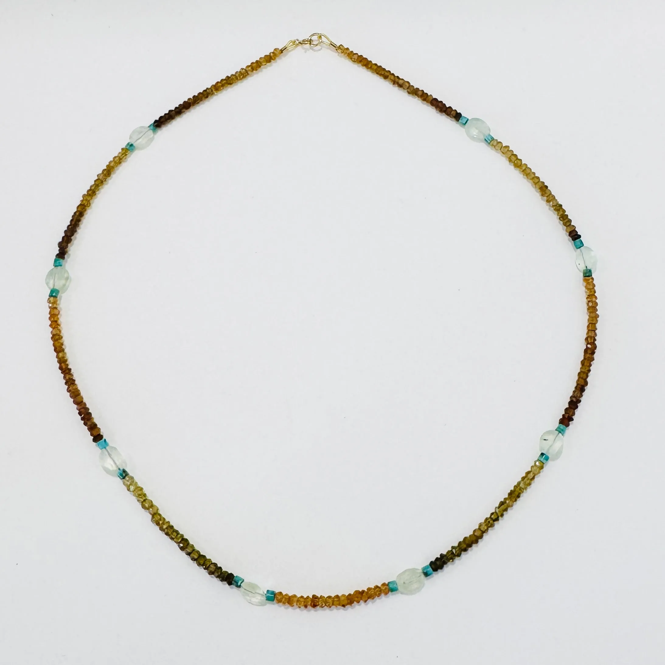 Hessonite garnet, turquoise, and prehnite delicate sold by Theodosia