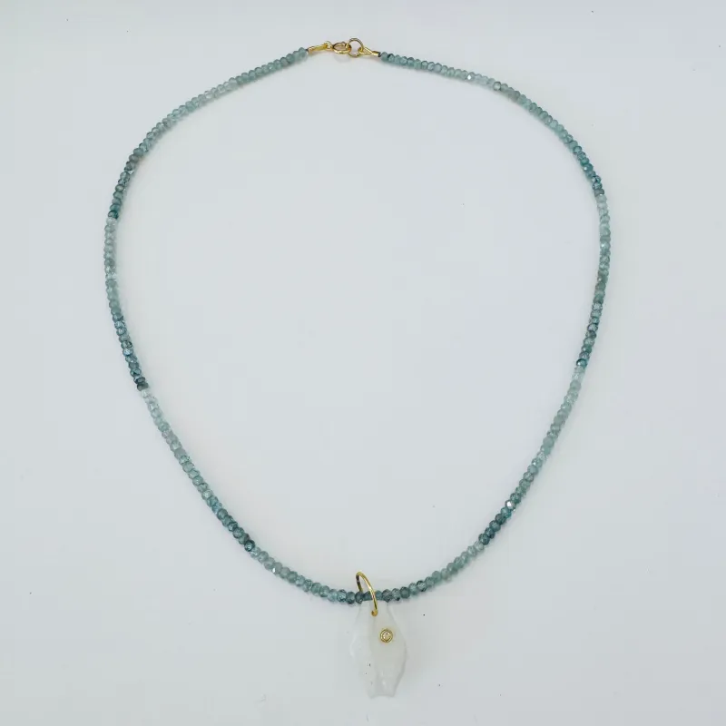 aquamarine with carved cowrie shell made by Theodosia