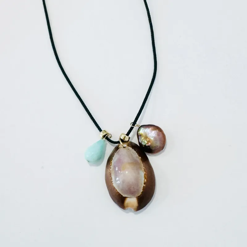 Kumihimo silk cord charm necklace, teal with blue opal, pearl, and purple cowrie shell made by Theodosia