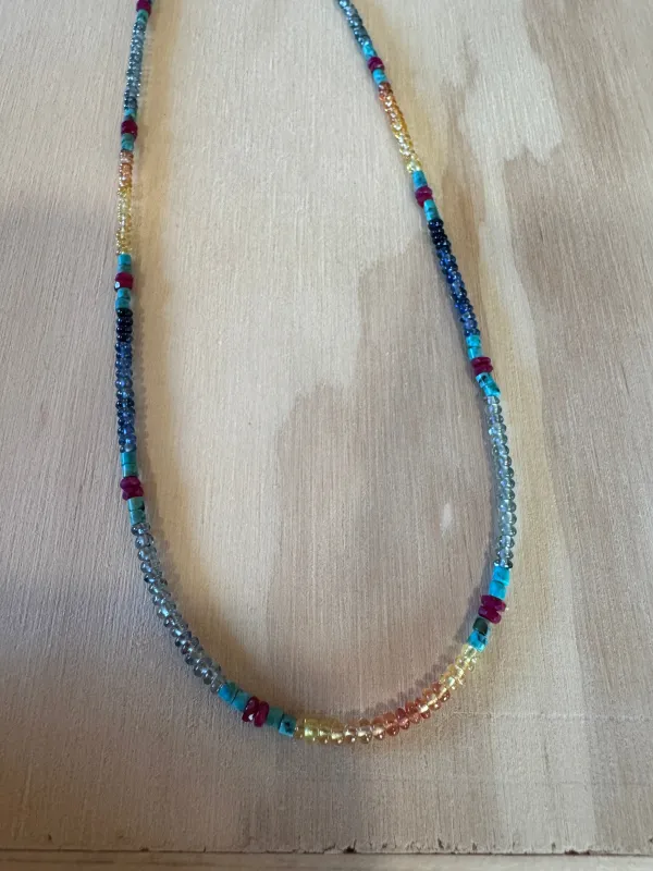 turquoise, ruby, and shaded sapphire heishi necklace sold by Theodosia