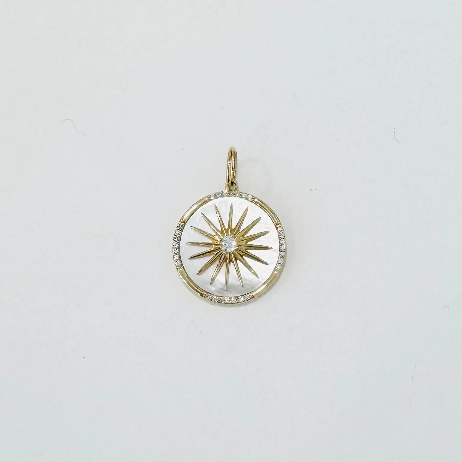 mother of pearl starburst pendant sold by Theodosia