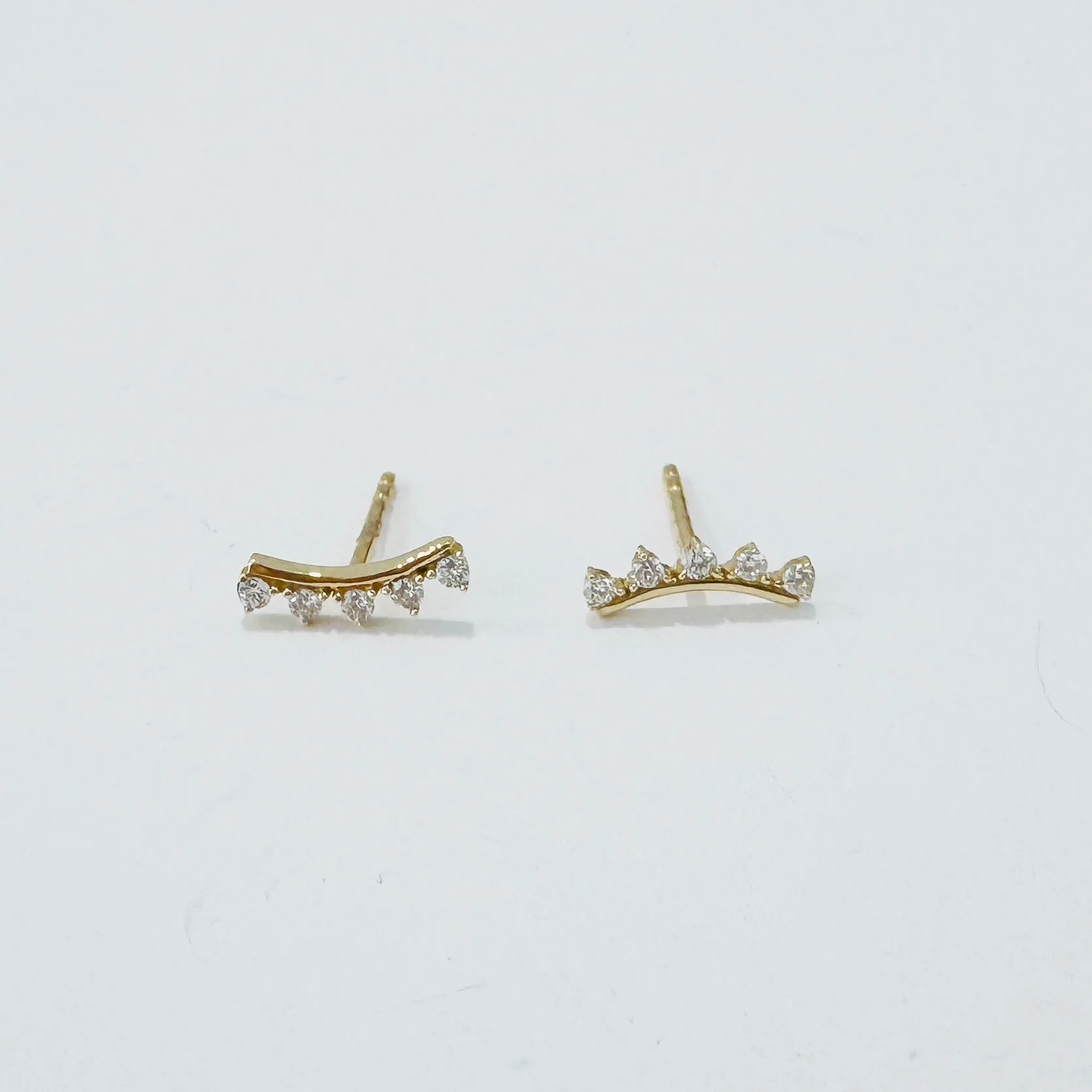 diamond arc studs sold by Theodosia