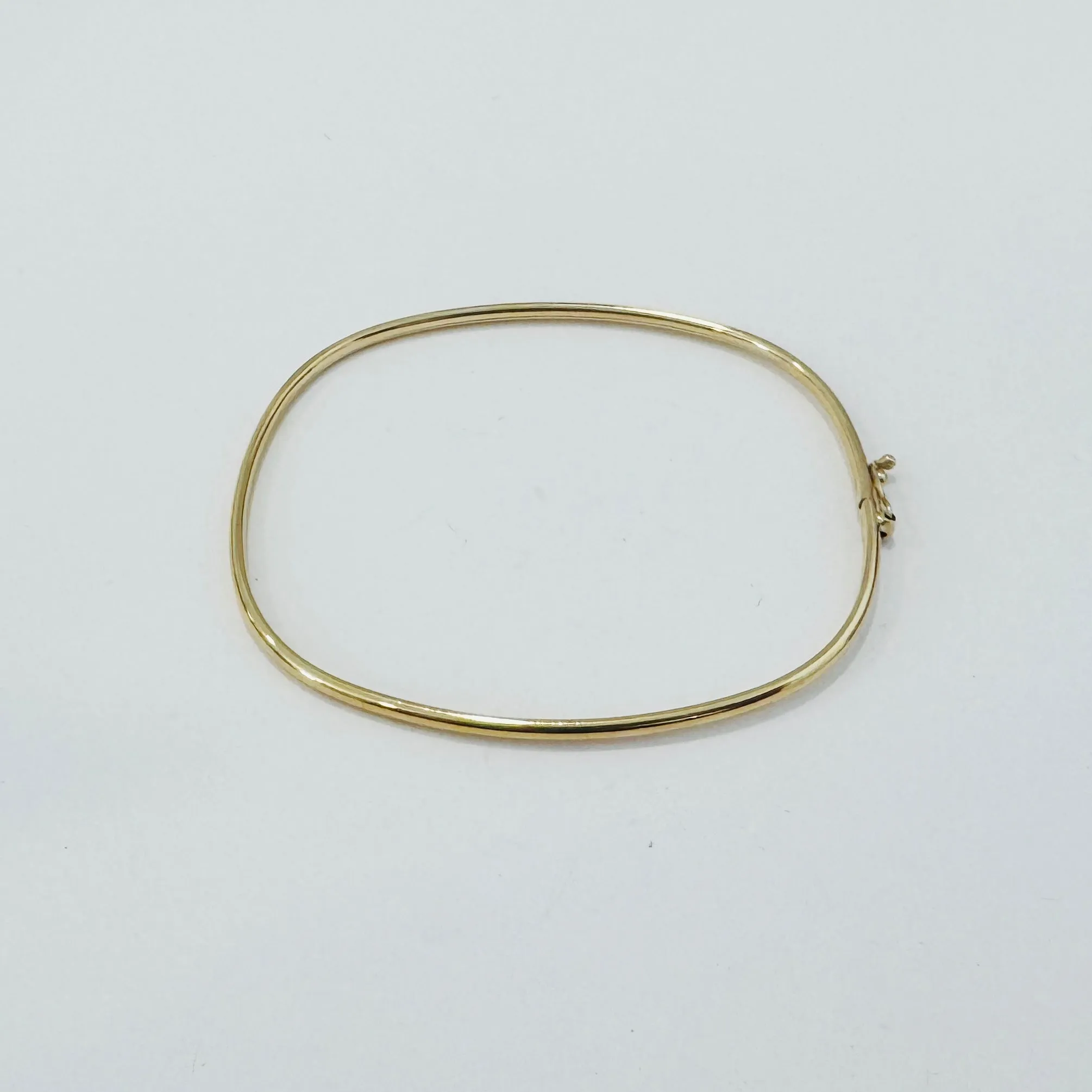 gold square bangle sold by Theodosia