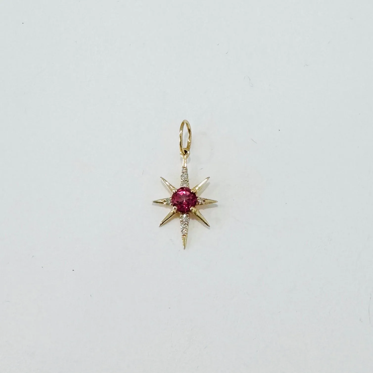 pink topaz and diamond starburst pendant sold by Theodosia