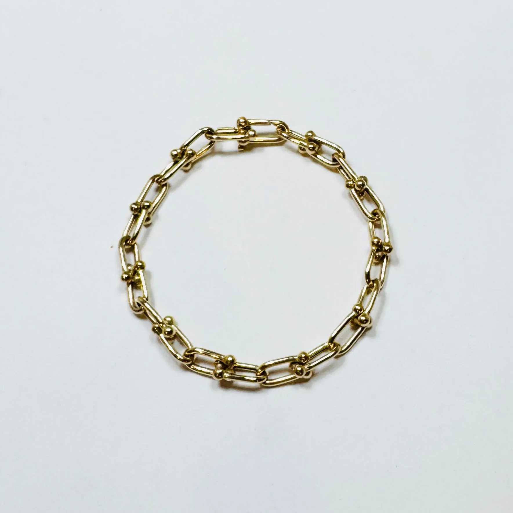 gold horse bit bracelet sold by Theodosia