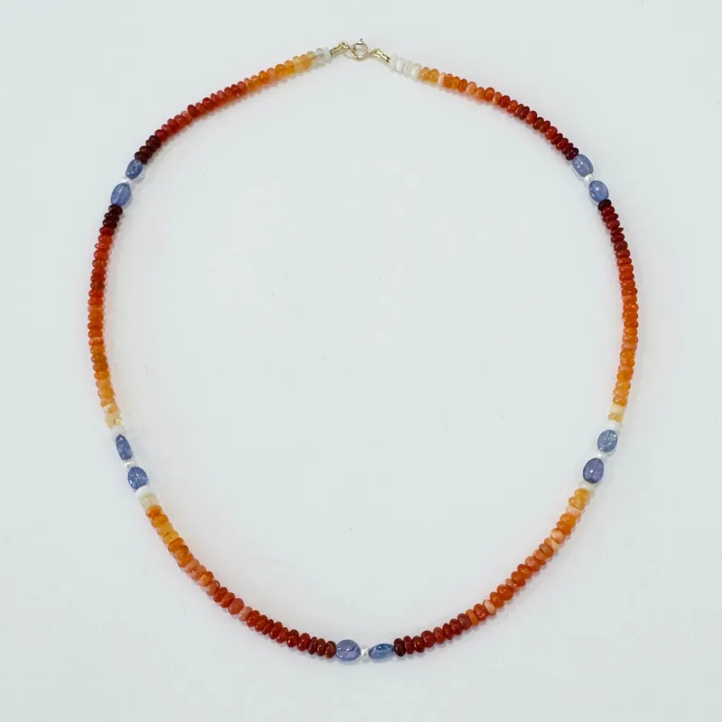 fire opal, tanzanite, and pearl delicate made by Theodosia