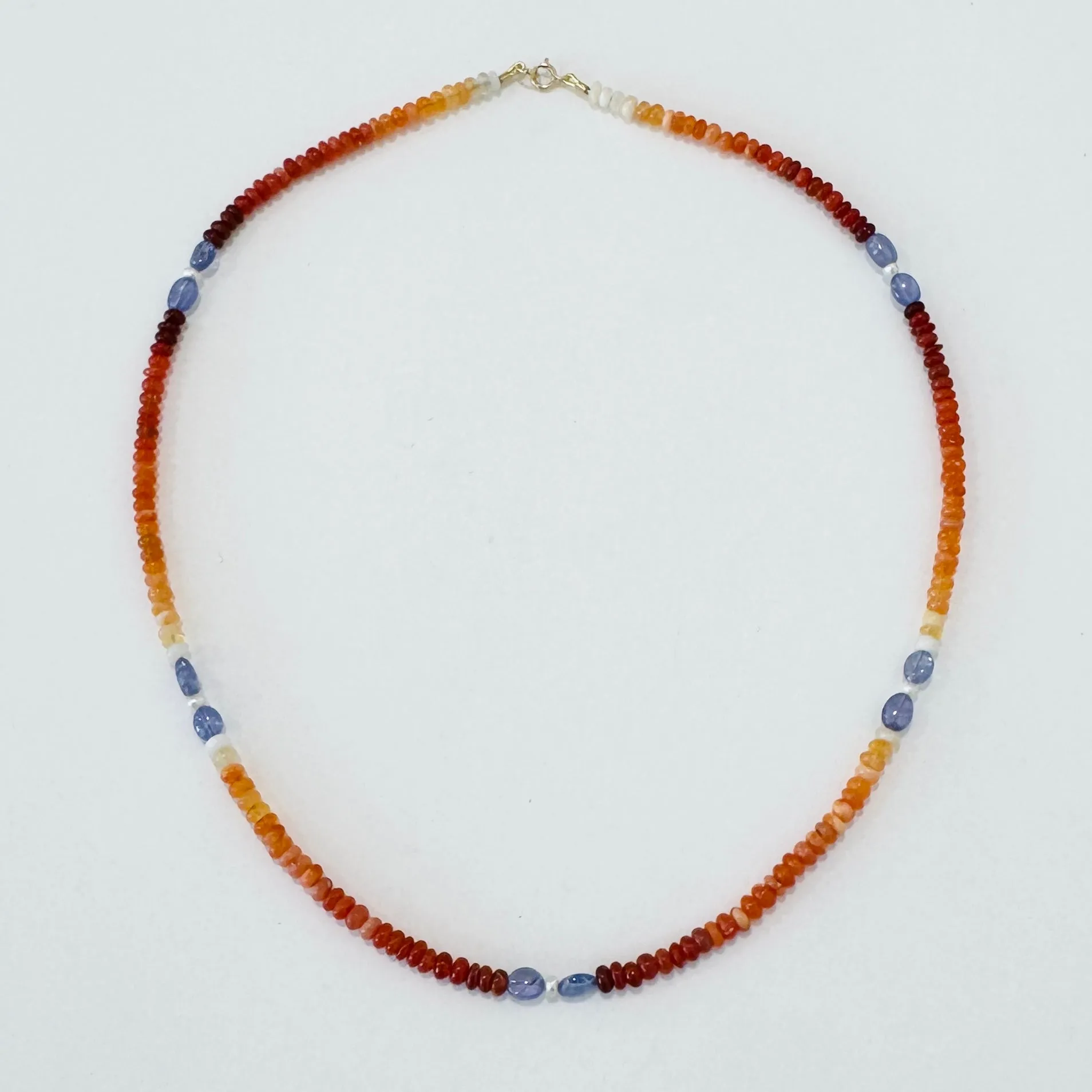 fire opal, tanzanite, and pearl delicate sold by Theodosia