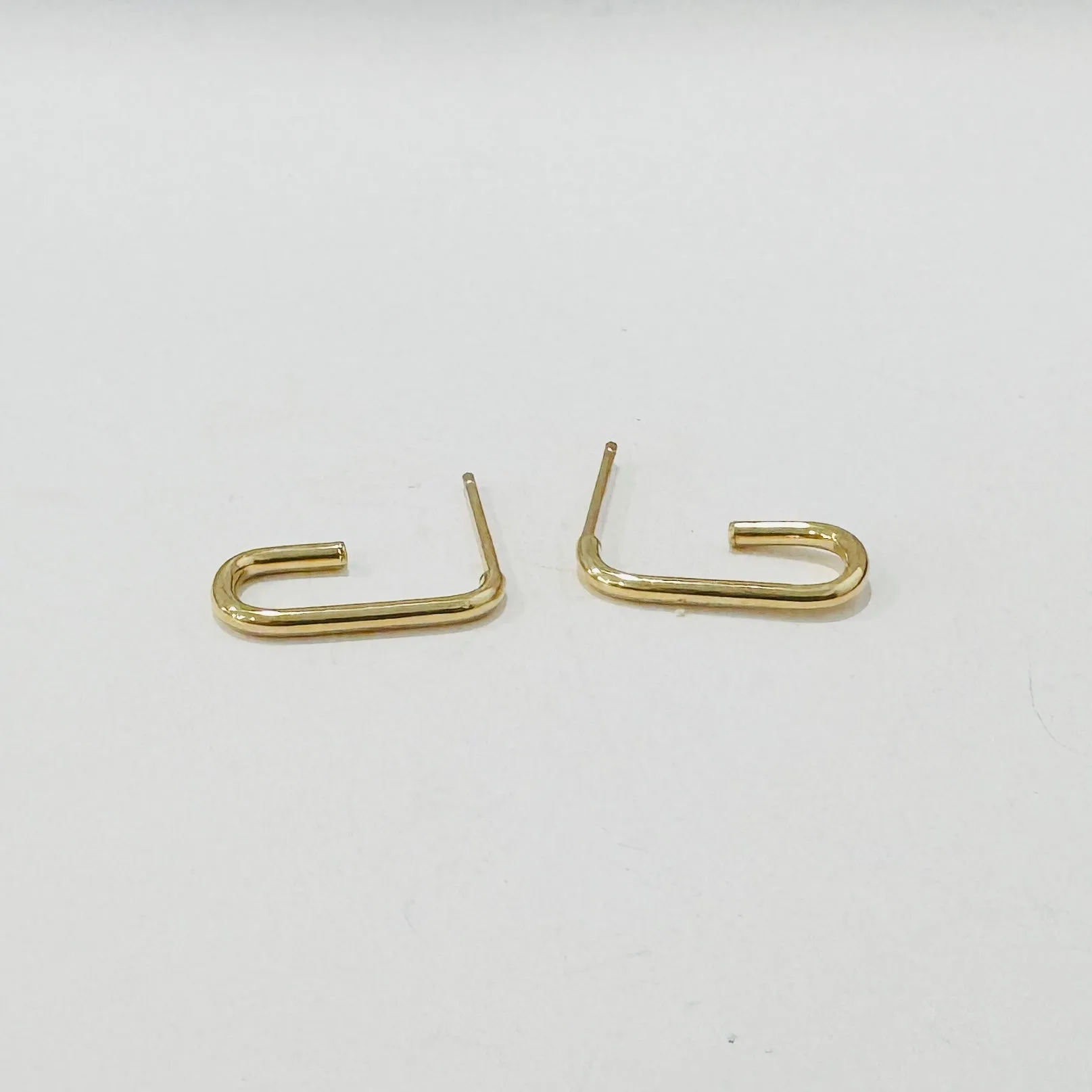 elongated gold hoops, 18 mm sold by Theodosia