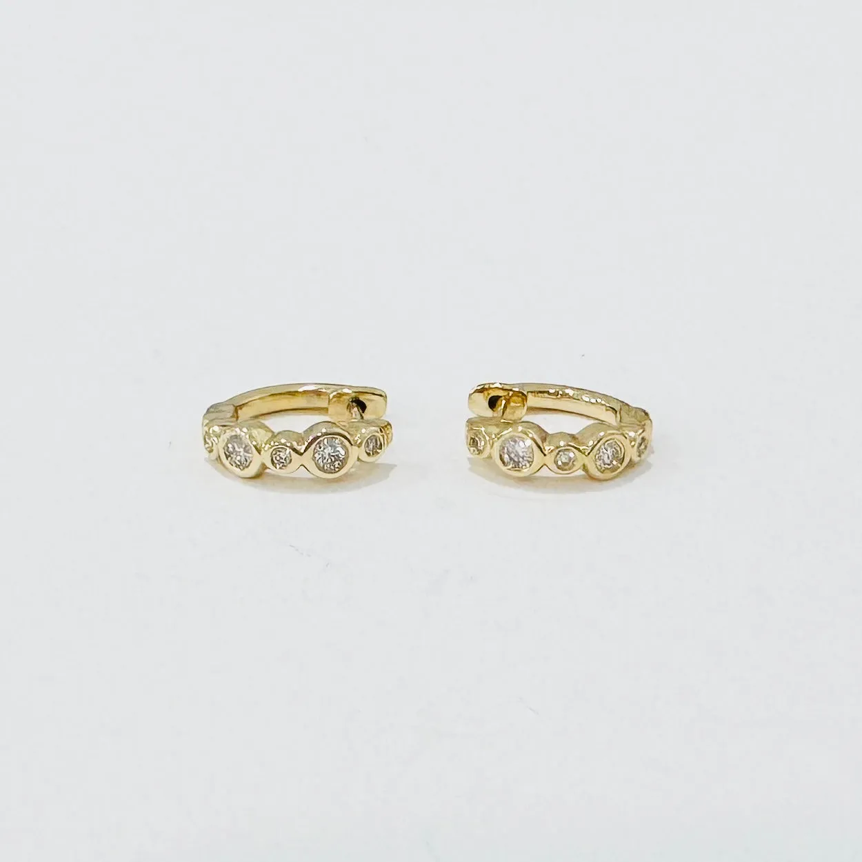 bezel diamond huggies sold by Theodosia