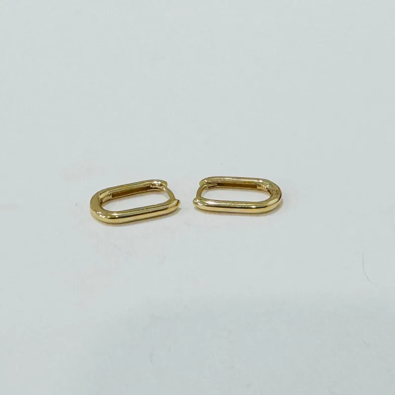 elongated gold huggies made by Theodosia