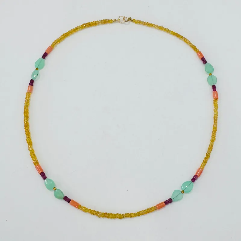 yellow sapphire, chrysoprase, ruby, and conch delicate made by Theodosia