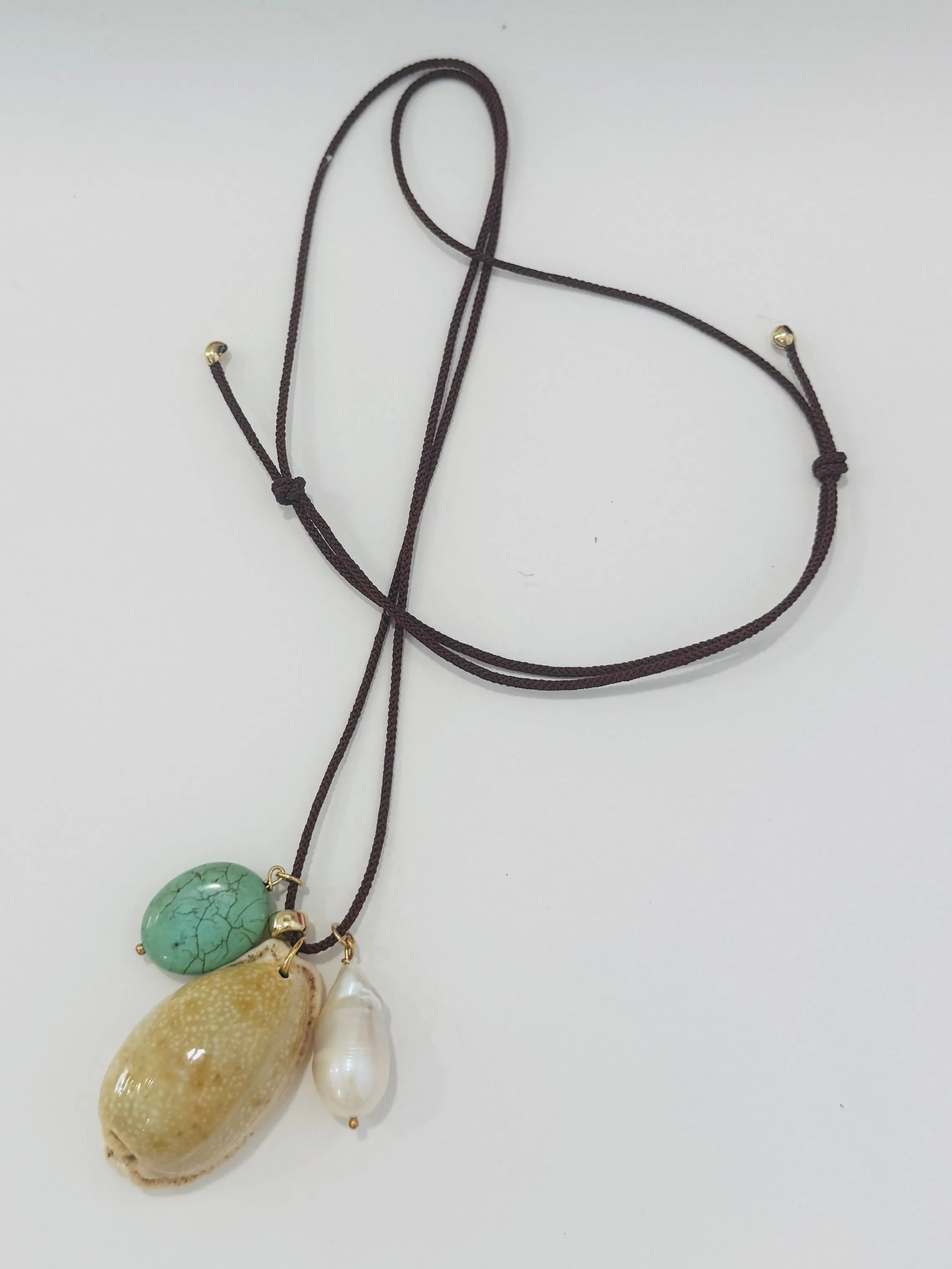 Kumihimo silk cord charm necklace, brown with turquoise, pearl, and cowrie sold by Theodosia