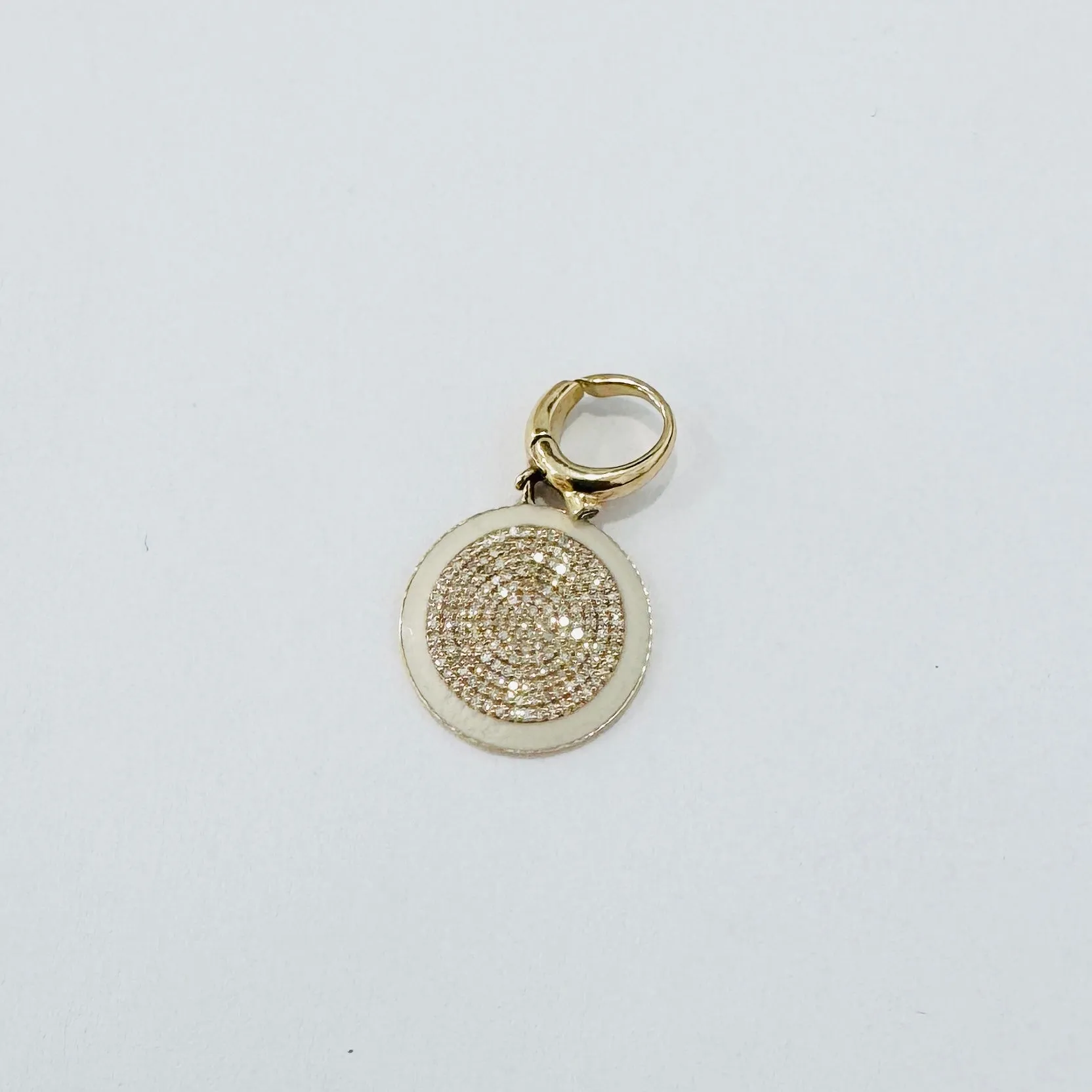 Cream enamel pave diamond disc pendant sold by Theodosia