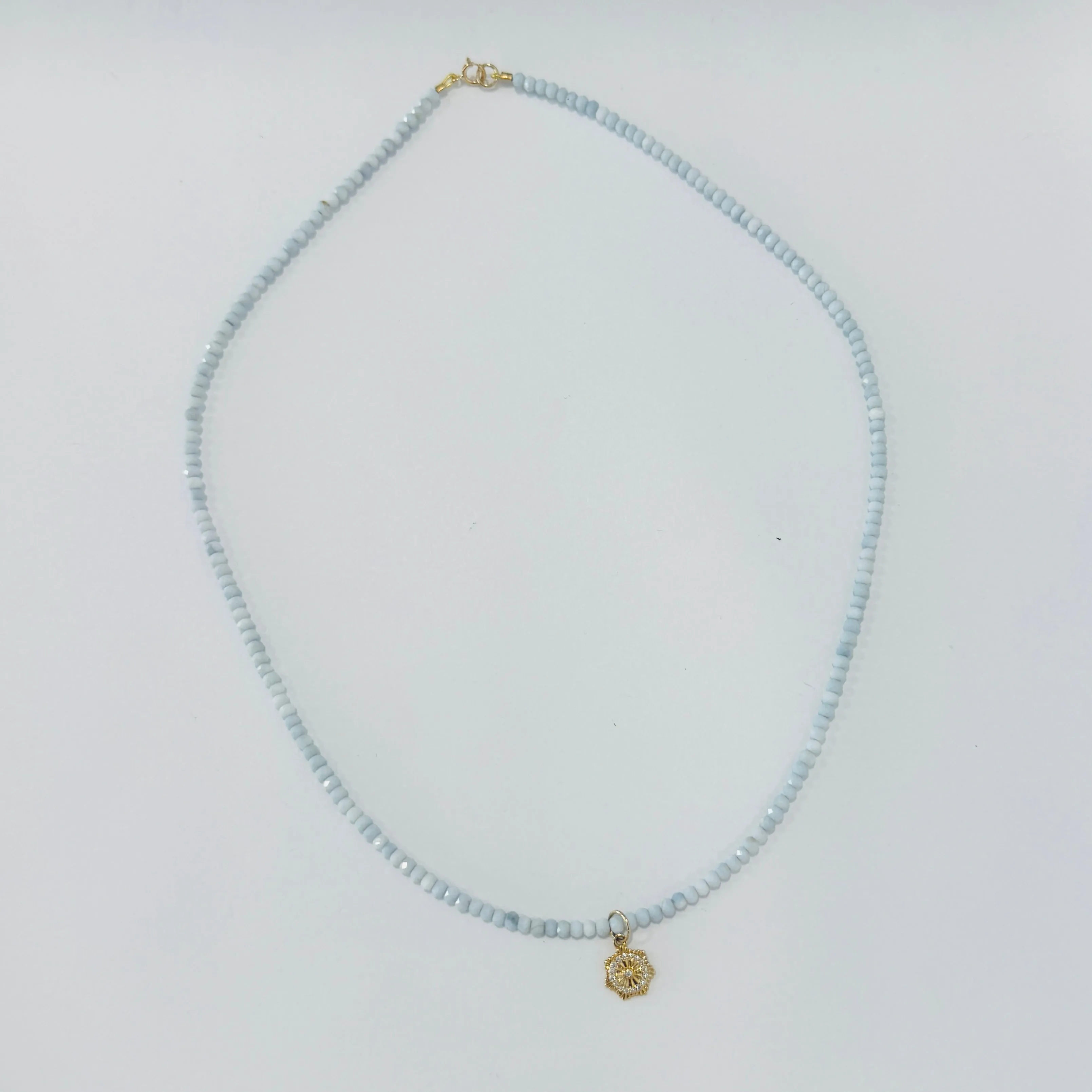 delicate gemstone necklace with quatrefoil charm sold by Theodosia
