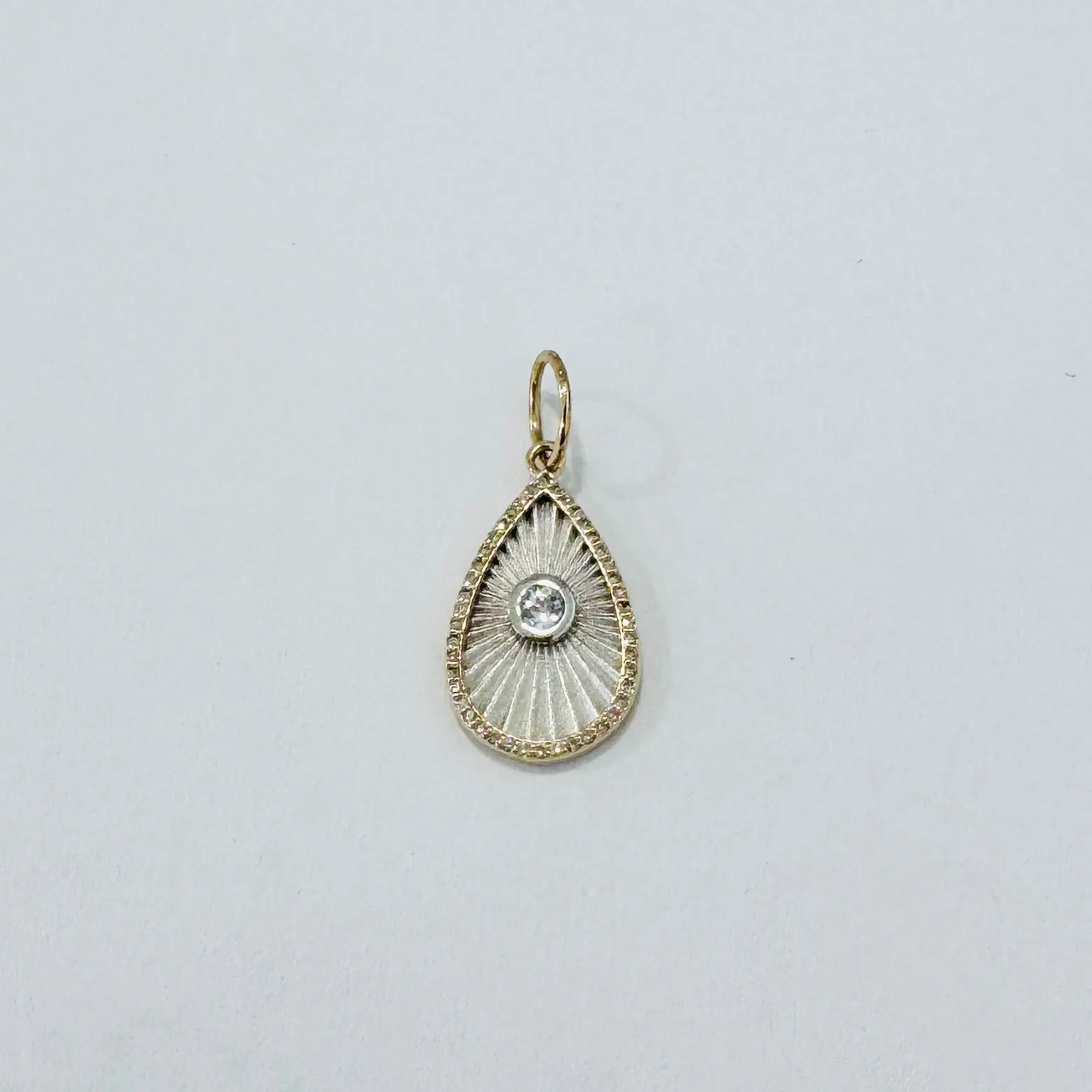 fluted mixed medal teardrop pendant sold by Theodosia