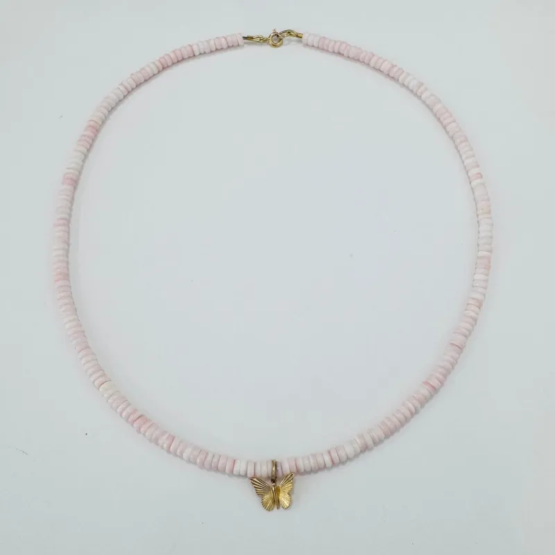 conch necklace with butterfly charm made by Theodosia
