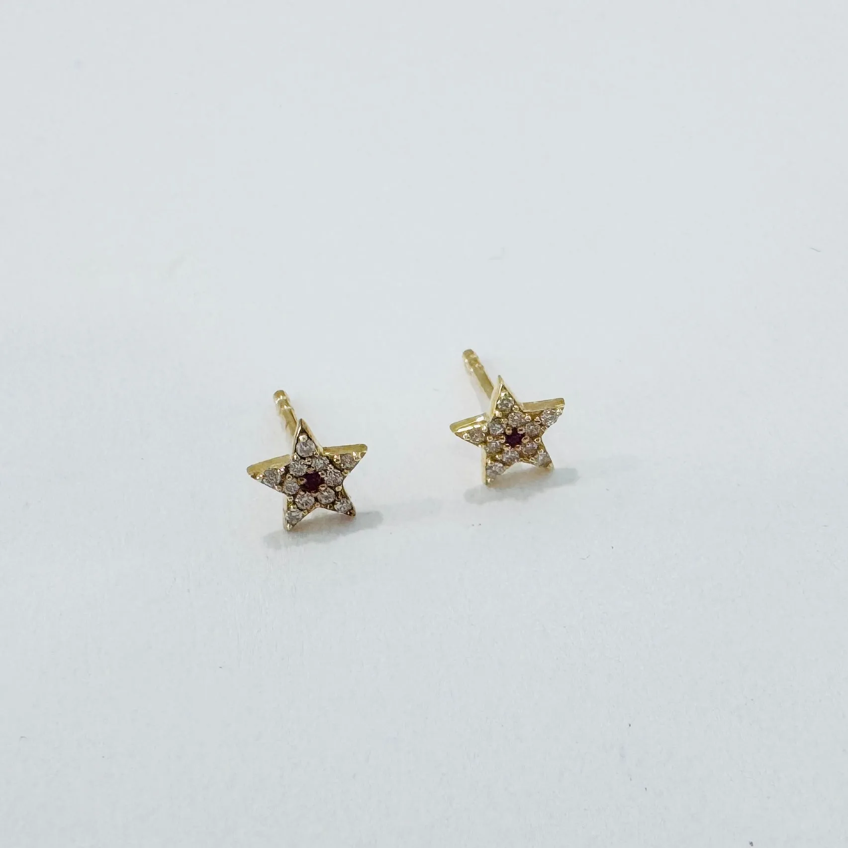 Pave diamond star studs sold by Theodosia