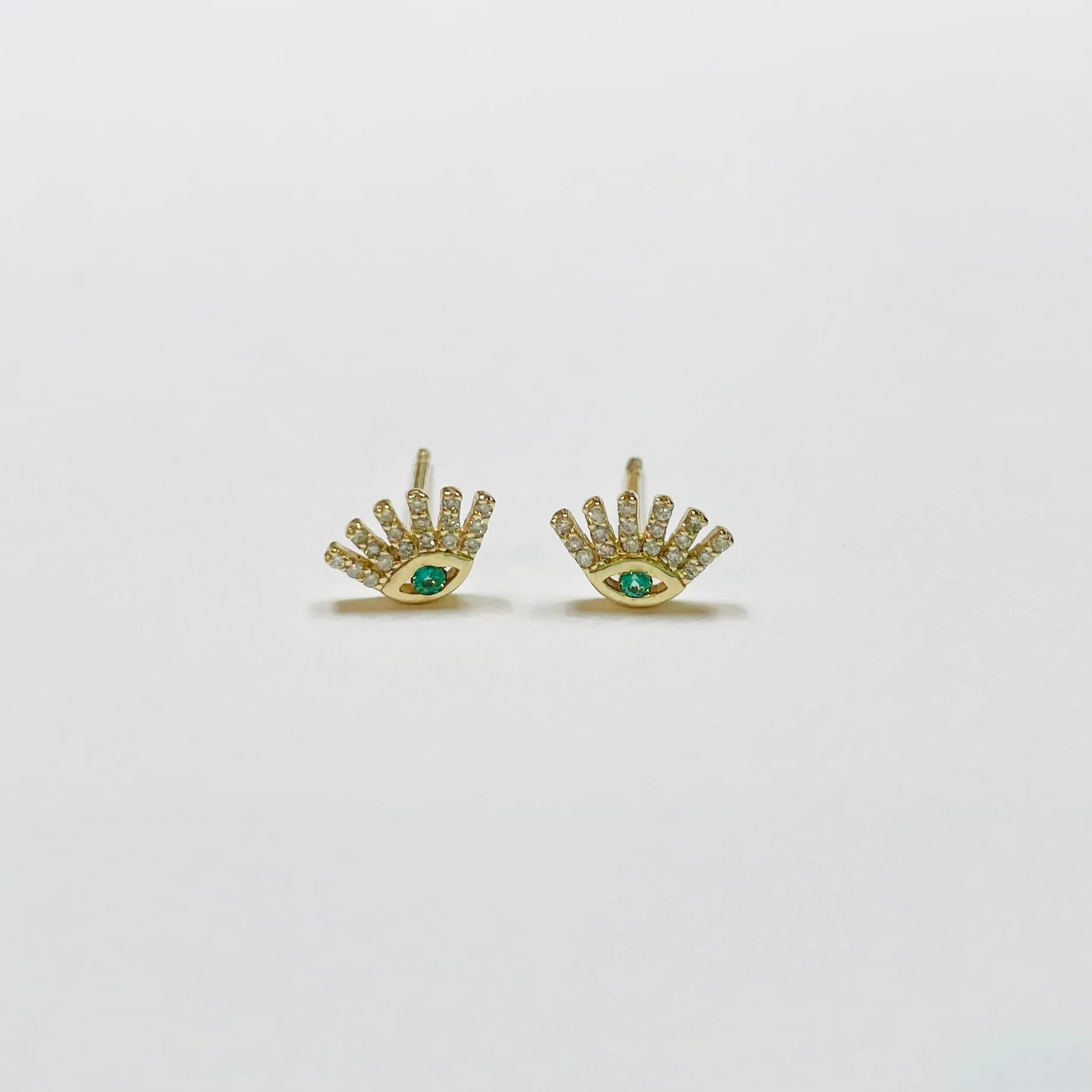 emerald and diamond evil eye studs sold by Theodosia