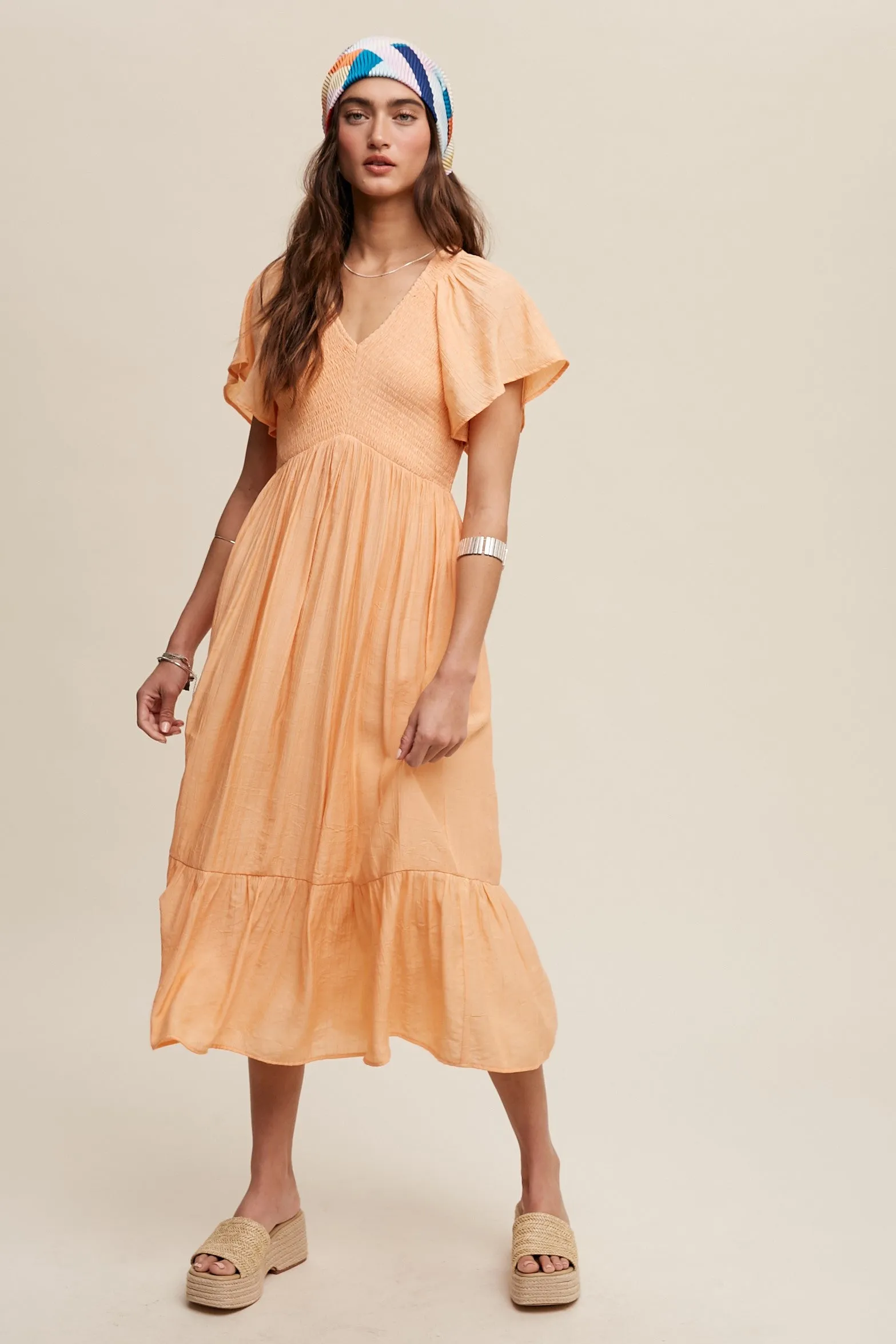 The Maisie Smocked Midi Dress sold by Thread & Seed