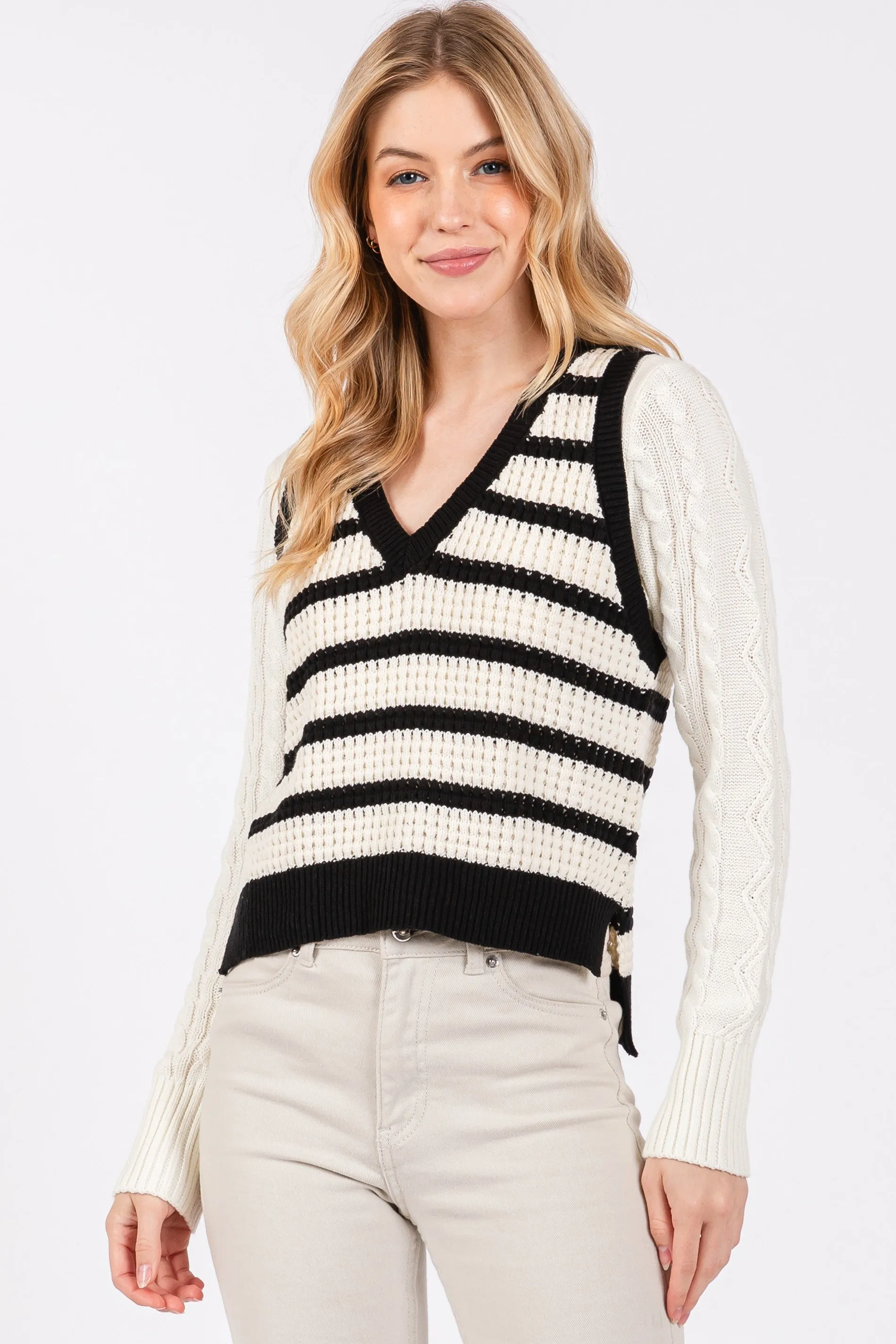 The Zaine Black Striped Sweater Vest sold by Thread & Seed