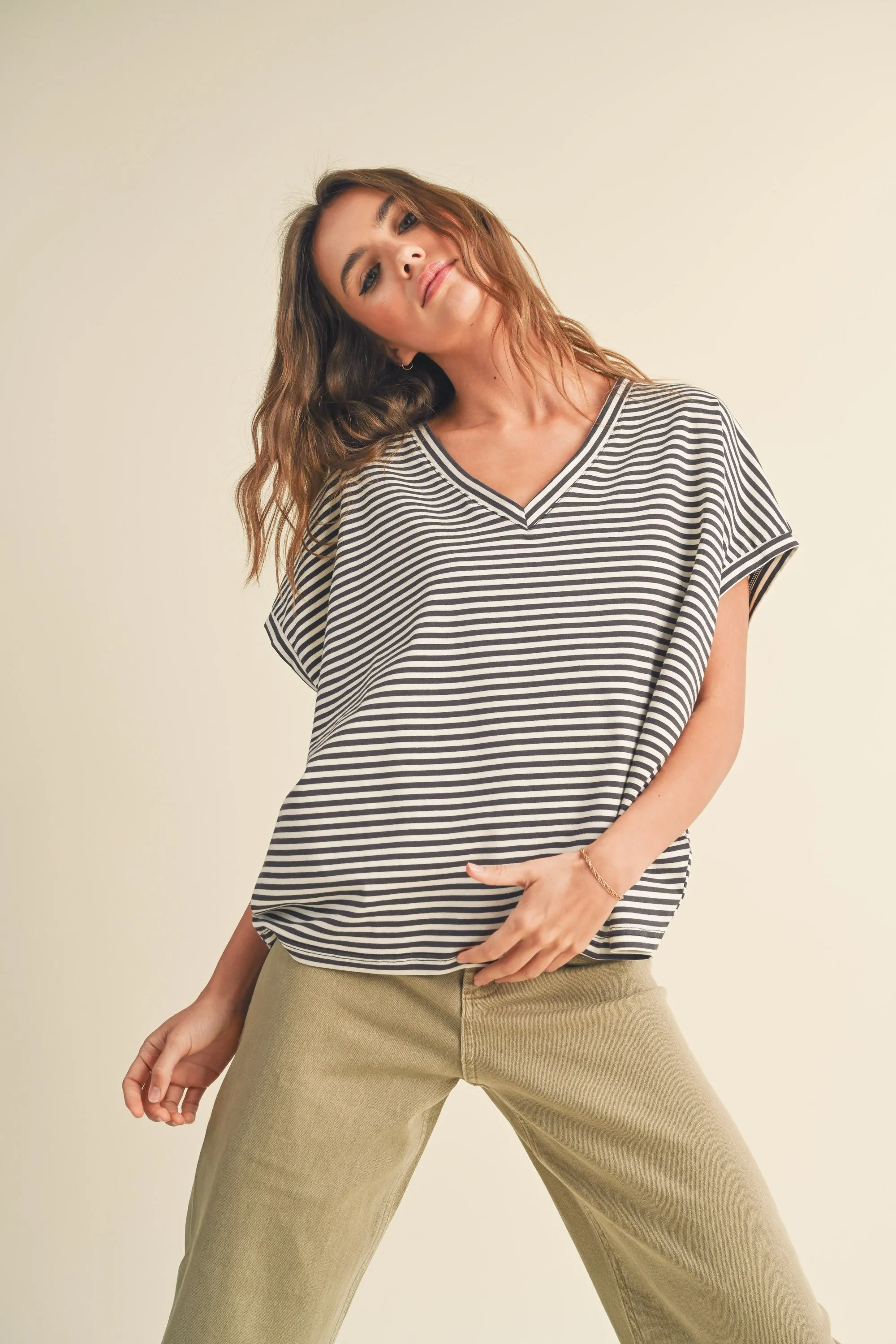 The Nico Striped Charcoal V-Neck Top sold by Thread & Seed