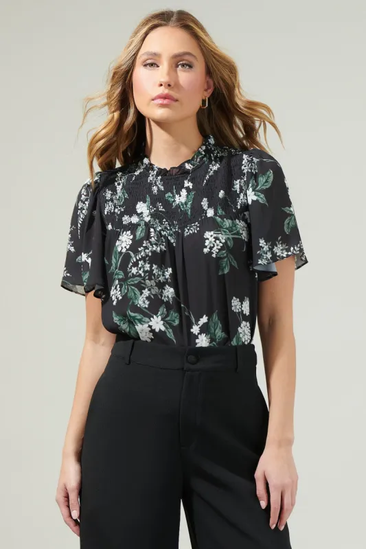 The Angelonia Smocked Blouse sold by Thread & Seed