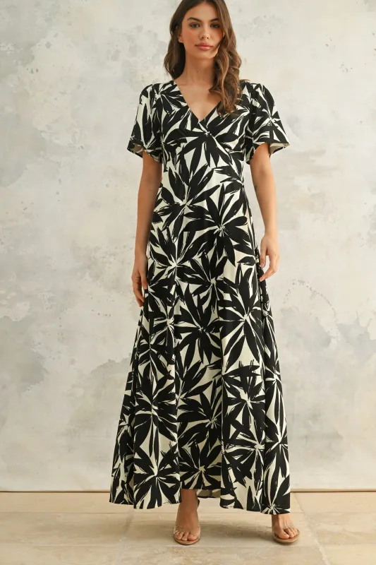 The Paola Tropical Leaf Print Dress sold by Thread & Seed