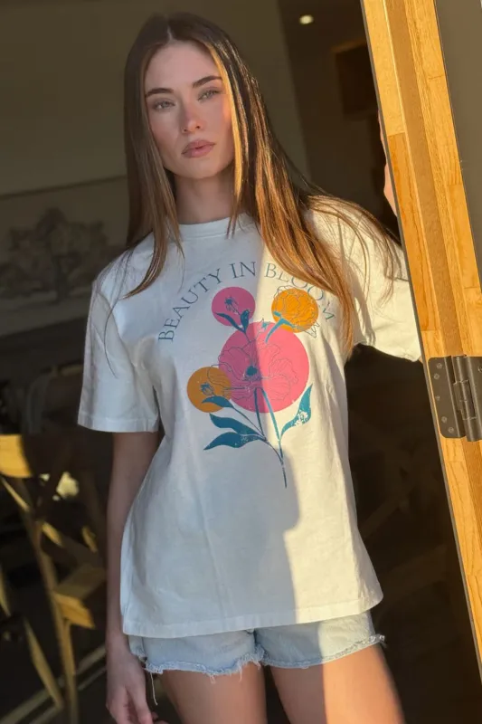 The 'Beauty In Bloom' Graphic Tee sold by Thread & Seed
