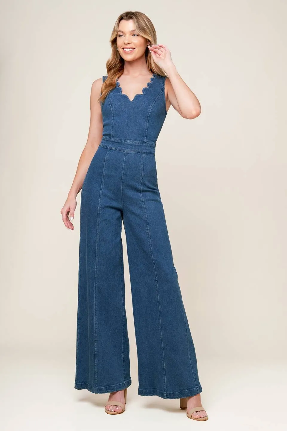 The Arielle Denim Scalloped Jumpsuit sold by Thread & Seed