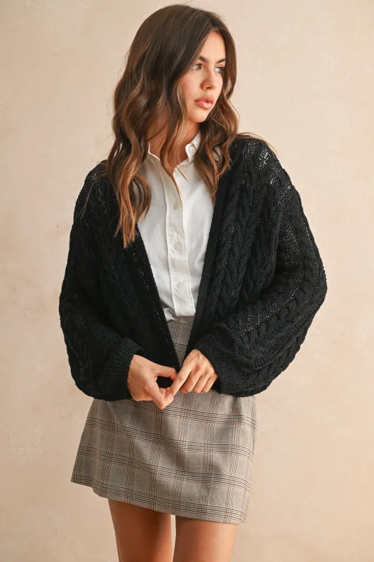 The Leslie Black Cable Knitted Cardigan sold by Thread & Seed