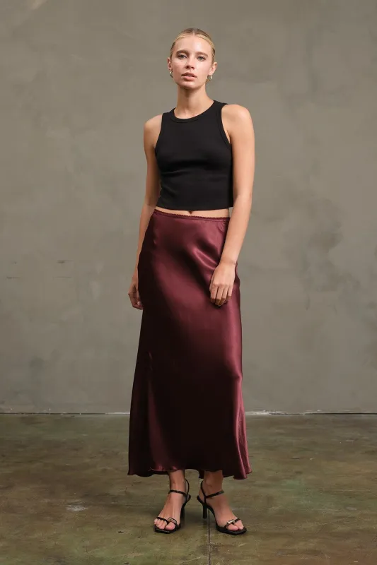 The Emelie Burgundy Satin Midi Skirt sold by Thread & Seed