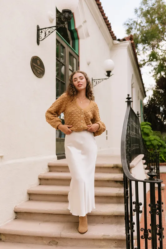 The Emelie Cream Satin Midi Skirt sold by Thread & Seed