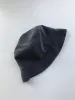 CHASSE ET PÊCHE iridescent bucket hat sold by Odeyalo