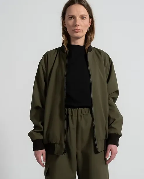 1ER MAI - Reversible Bomber Jacket in olive green/black sold by Odeyalo
