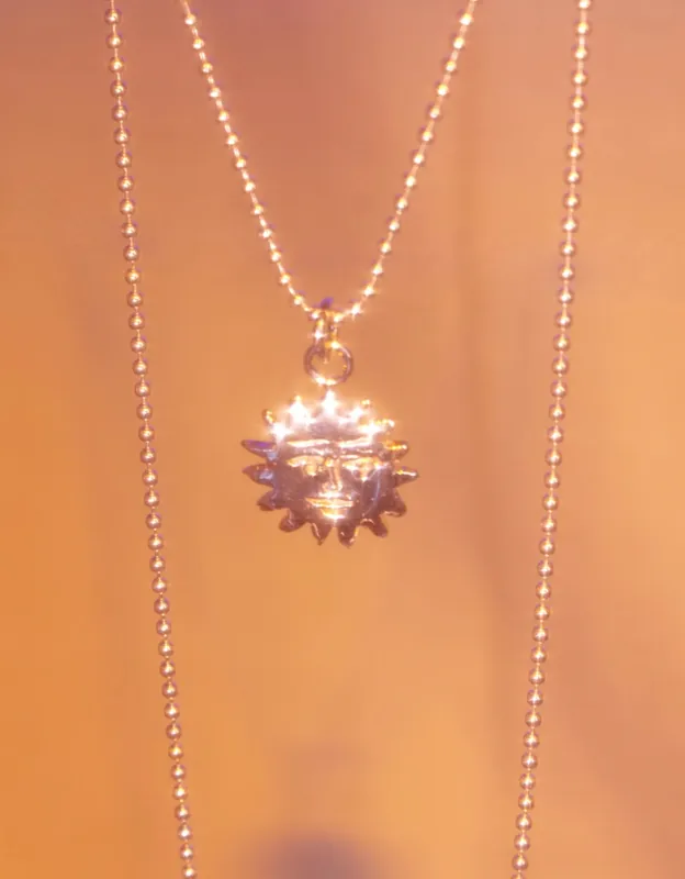 BILAK -  Sun Charm Necklace sold by Odeyalo