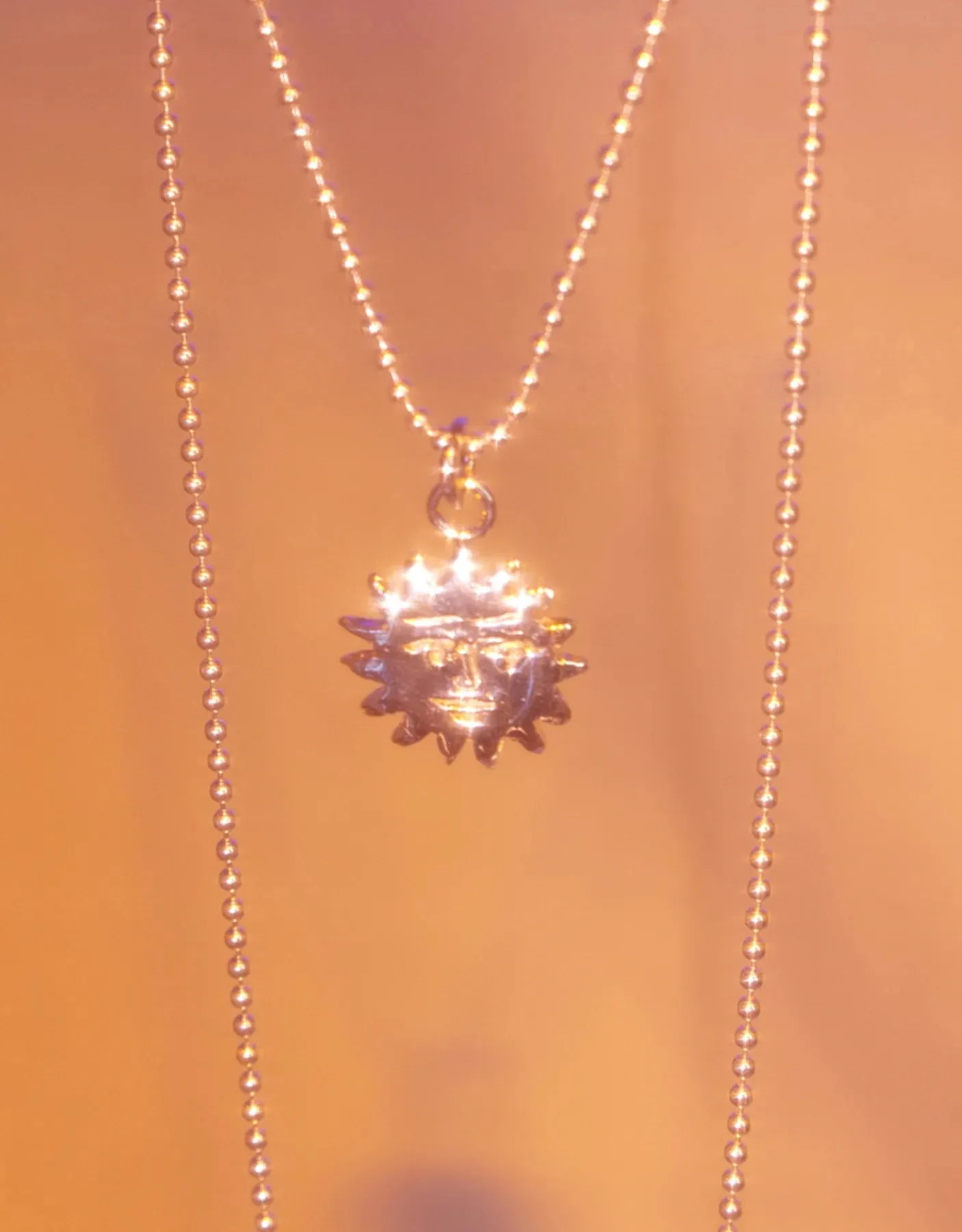 BILAK - Sun Charm Necklace sold by Odeyalo