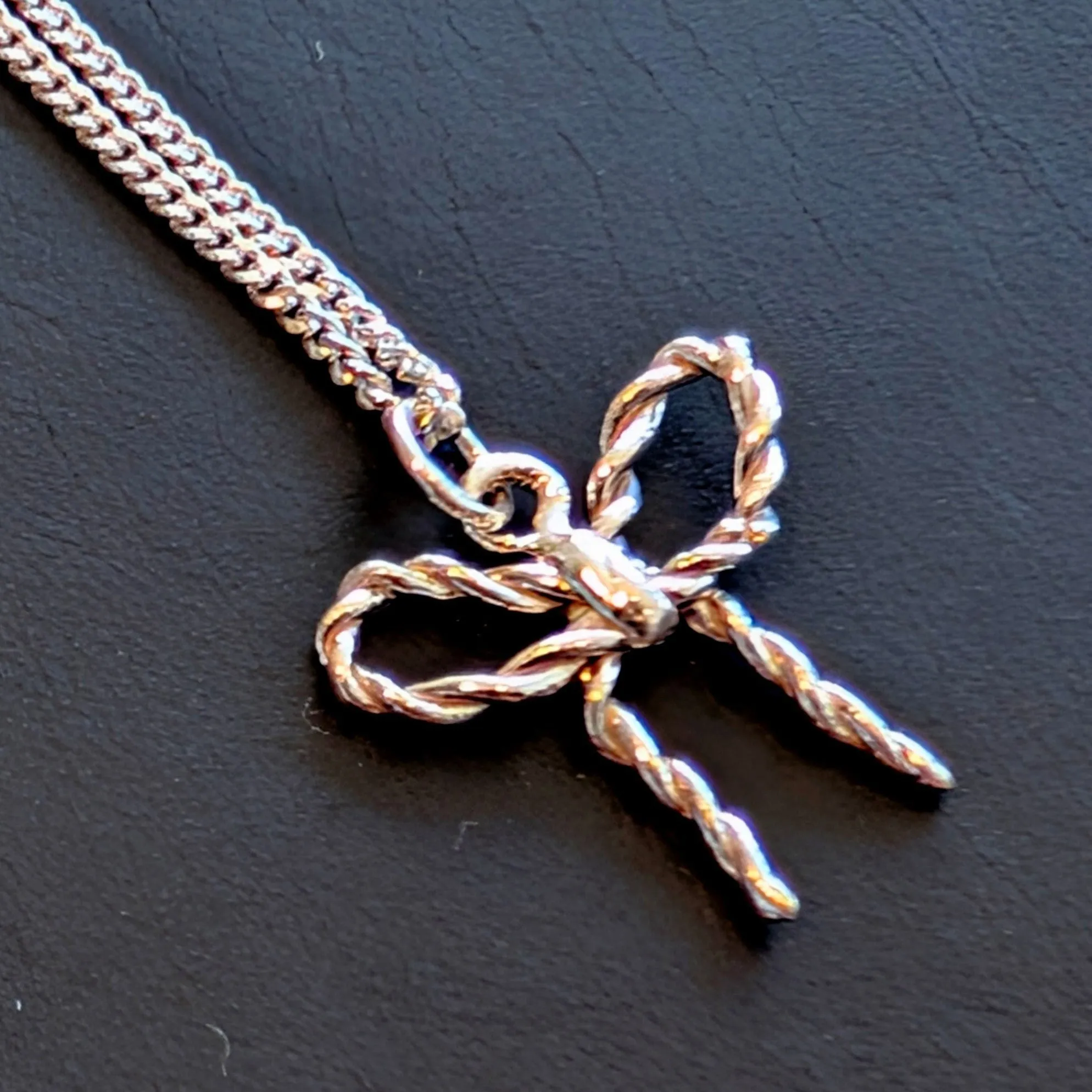 BILAK - Bow Charm Necklace sold by Odeyalo