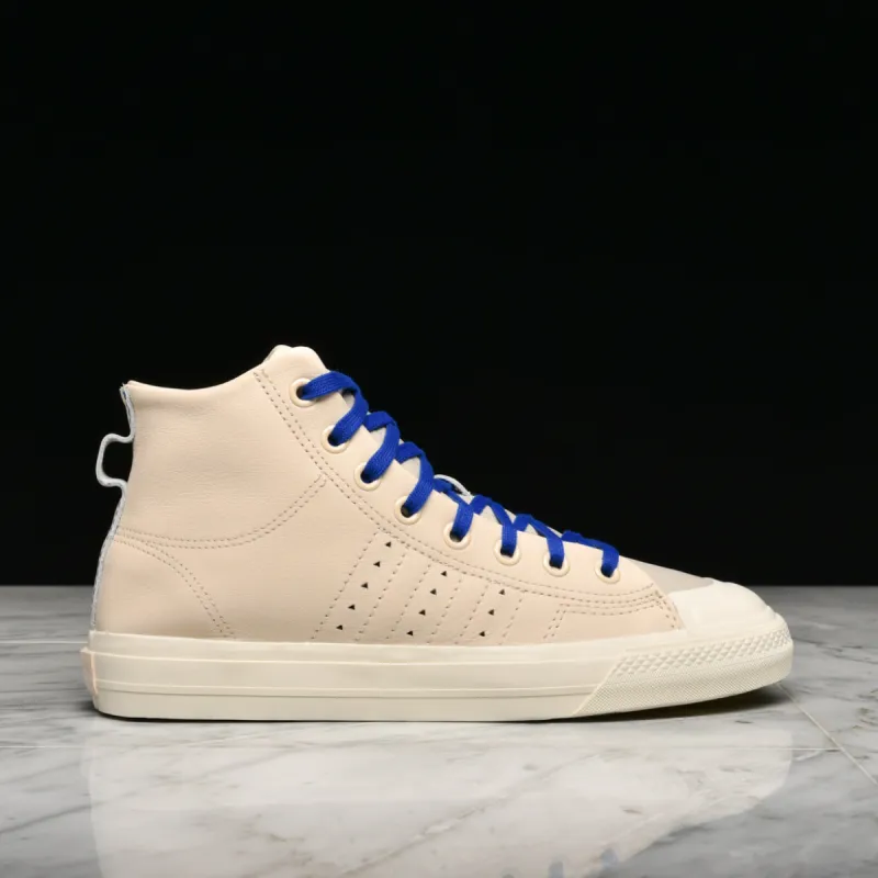 PHARRELL WILLIAMS X ADIDAS NIZZA HI RF - ECRU TINT / CREAM WHITE / CLEAR BROWN sold by Lapstone & Hammer