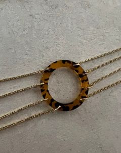 Belly chain with tortoise ring sold by MARS THE LABEL