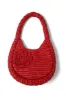 straw rosette bag sold by Damson Madder