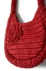 straw rosette bag sold by Damson Madder