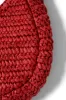 straw rosette bag sold by Damson Madder