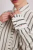 kylie ruffle shirt - white stripe sold by Damson Madder