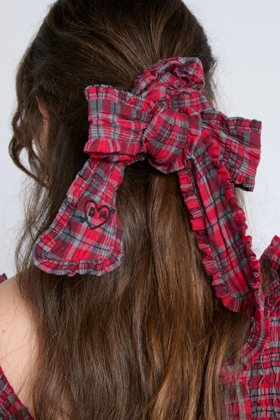 red check bow scrunchie sold by Damson Madder