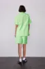 textured woven jacquard green short sold by Damson Madder
