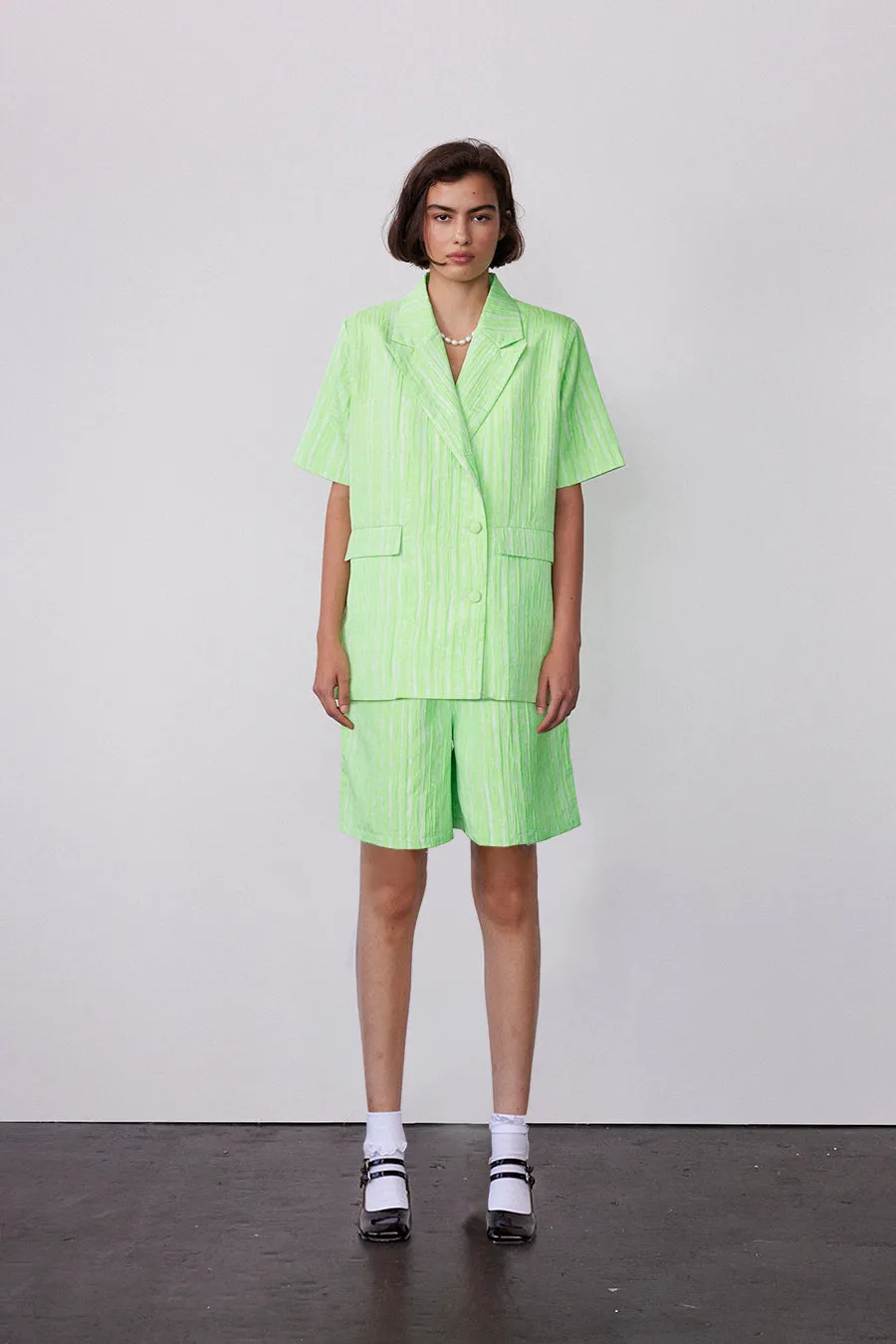 textured woven jacquard green short sold by Damson Madder