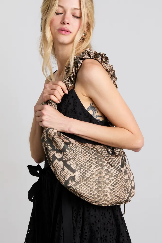ruched kidney bag in snake print sold by Damson Madder