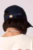 navy embroidered cap sold by Damson Madder