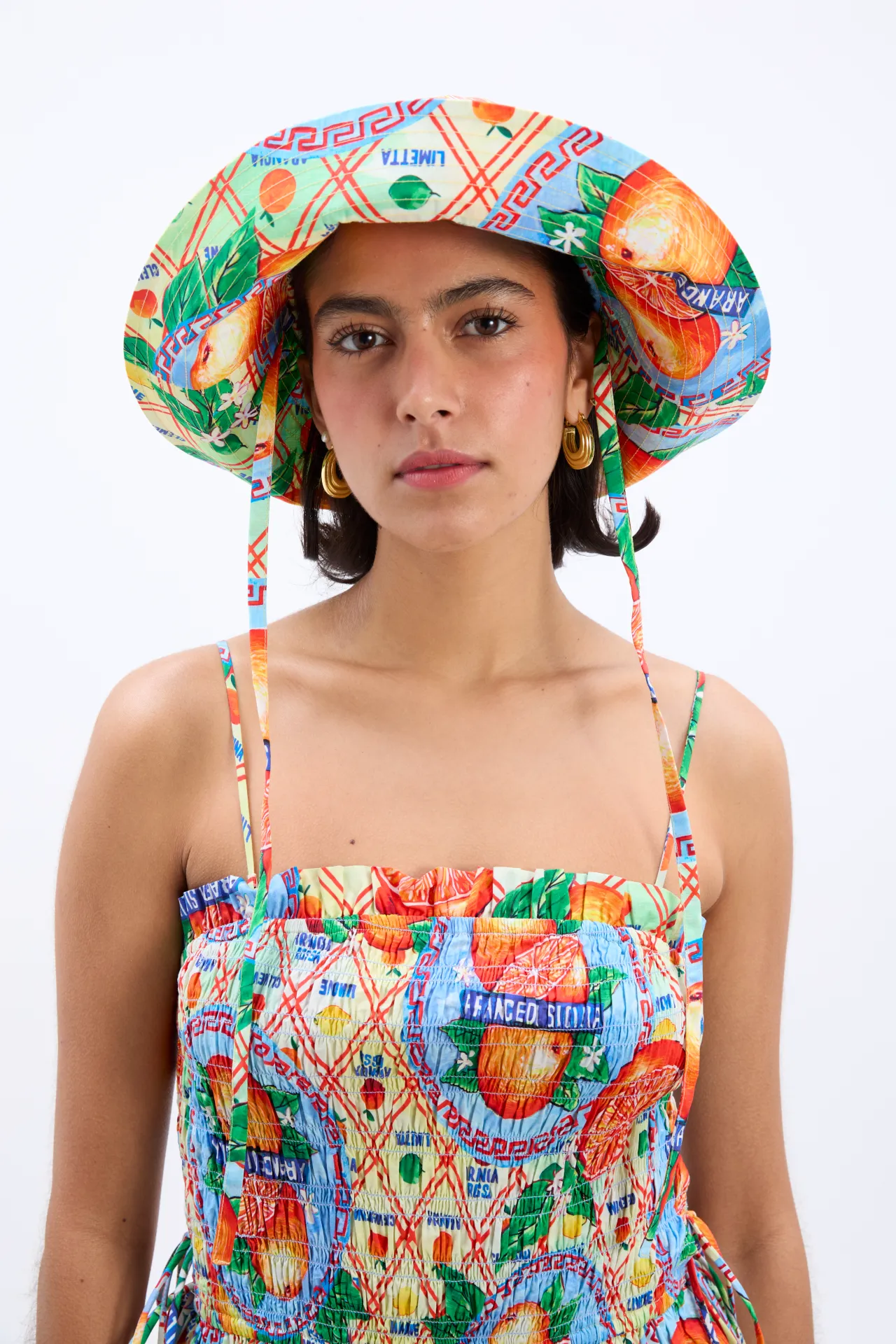 sunhat - orange fruit wrapper sold by Damson Madder
